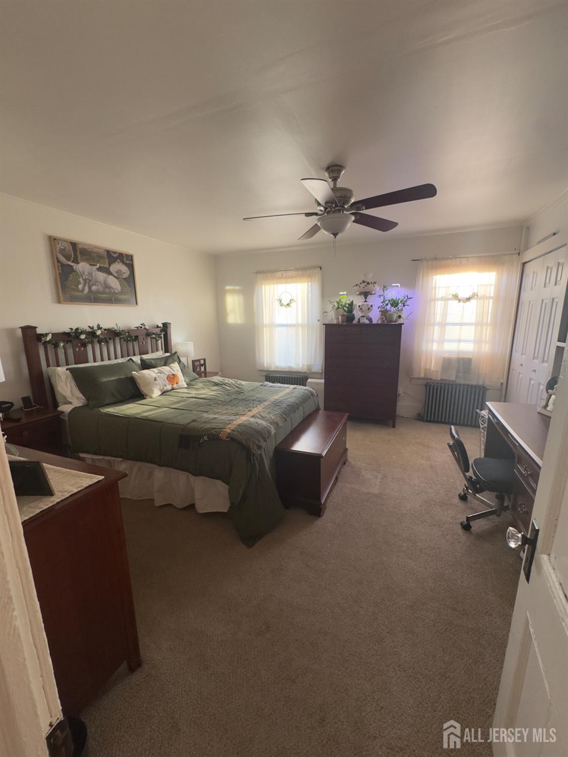 41 Atlantic Street Keyport, NJ 07735 - Photo 4 of 48 a living room with furniture and a chandelier