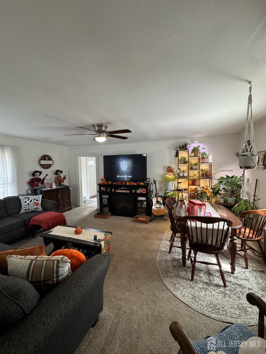 41 Atlantic Street Keyport, NJ 07735 - Photo 8 of 48 a living room with furniture and a flat screen tv