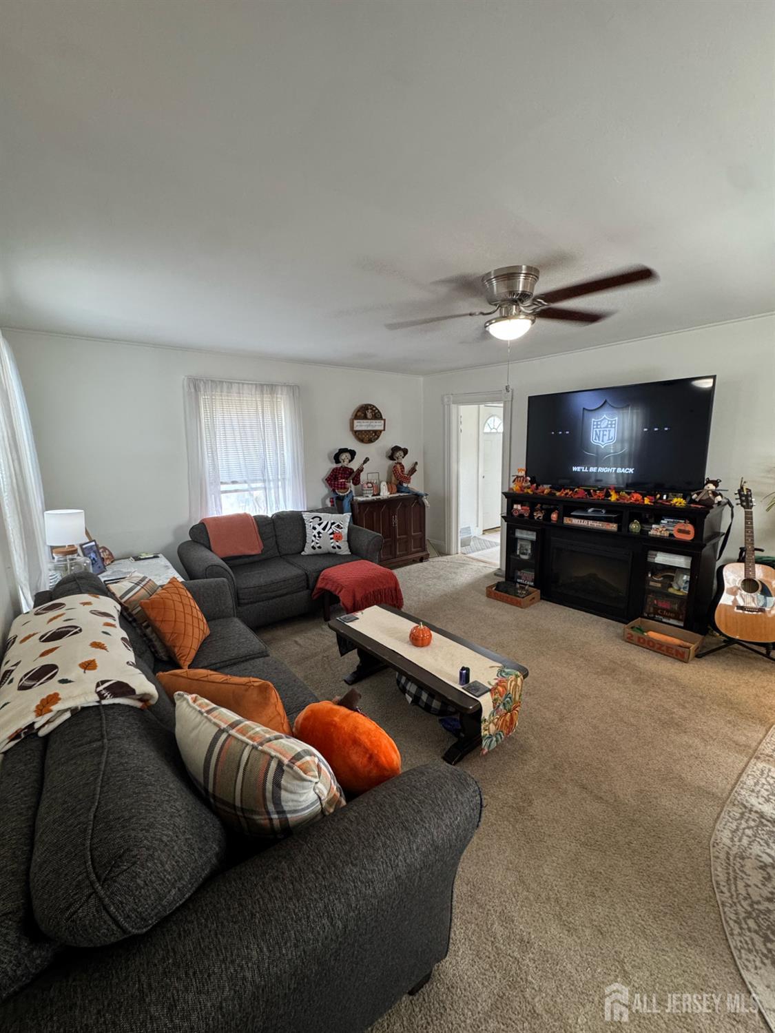 41 Atlantic Street Keyport, NJ 07735 - Photo 9 of 48 a living room with furniture and a flat screen tv