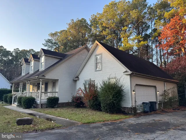 a room with gym equipment and a flat screen tv