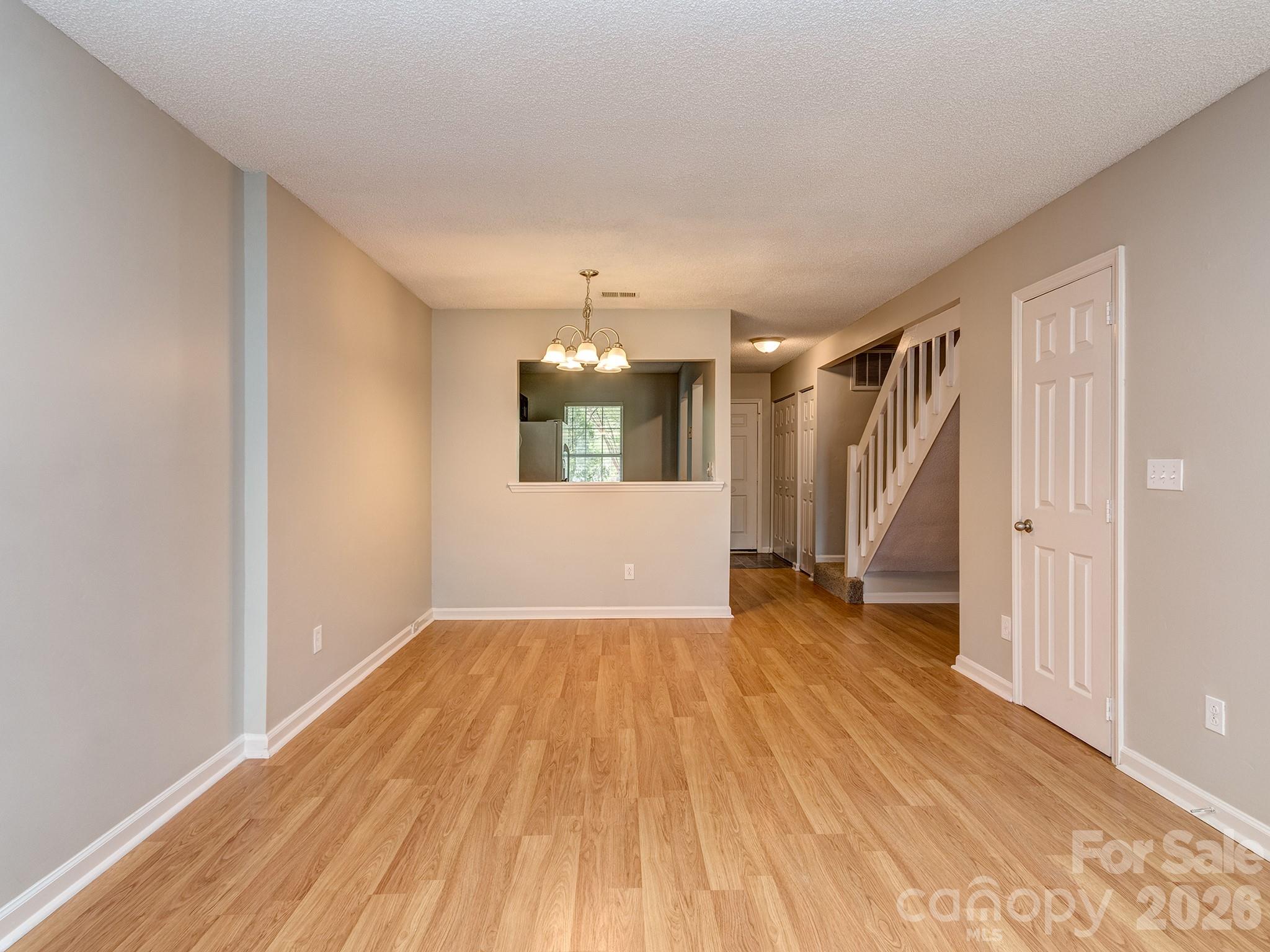 8211 Golf Ridge Drive Charlotte, NC 28277 - Photo 14 of 40 an empty room with wooden floor and window