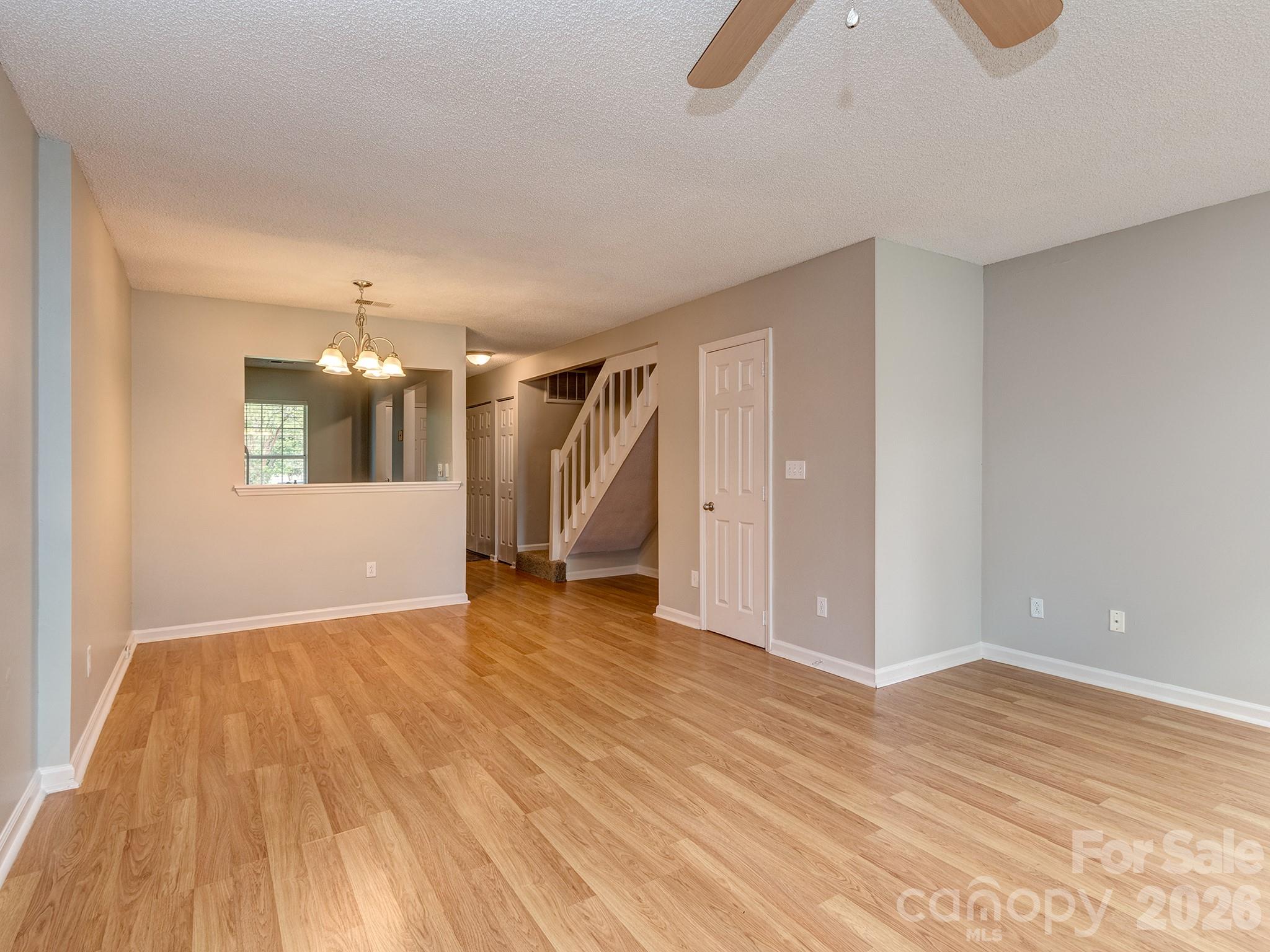 8211 Golf Ridge Drive Charlotte, NC 28277 - Photo 15 of 40 wooden floor in an empty room with a window