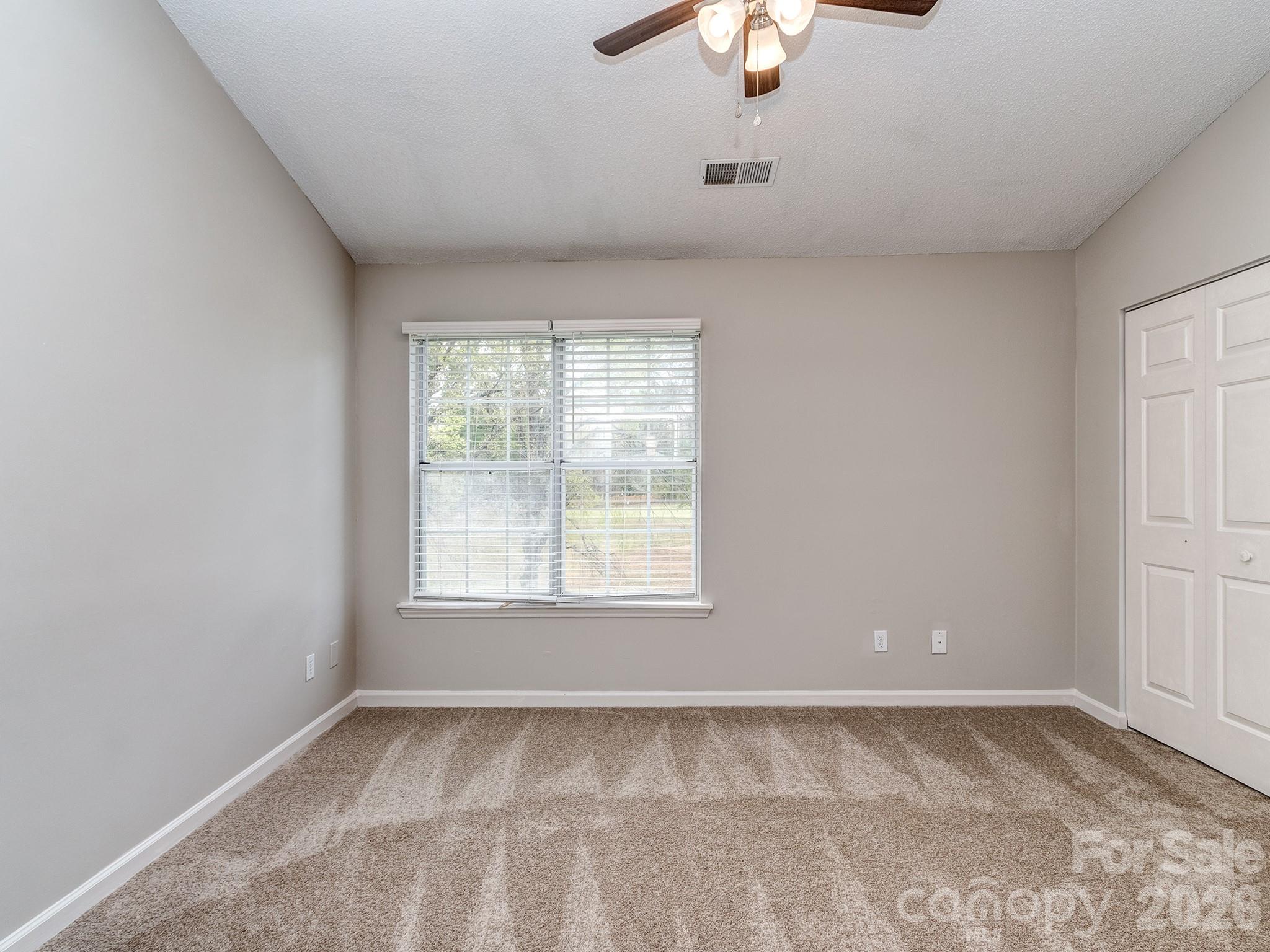 8211 Golf Ridge Drive Charlotte, NC 28277 - Photo 17 of 40 an empty room with a window
