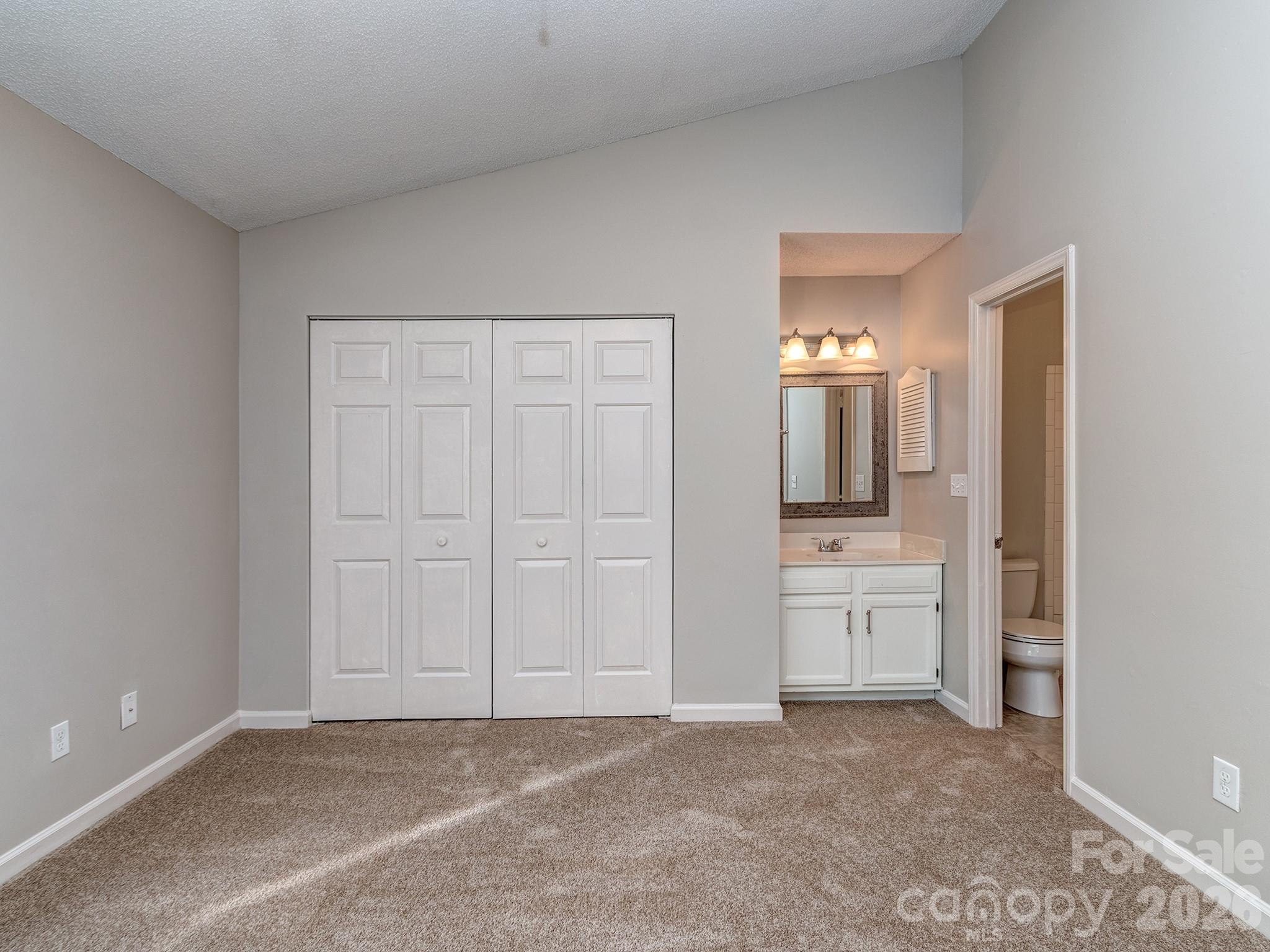 8211 Golf Ridge Drive Charlotte, NC 28277 - Photo 19 of 40 wooden floor and closet in a en suite room
