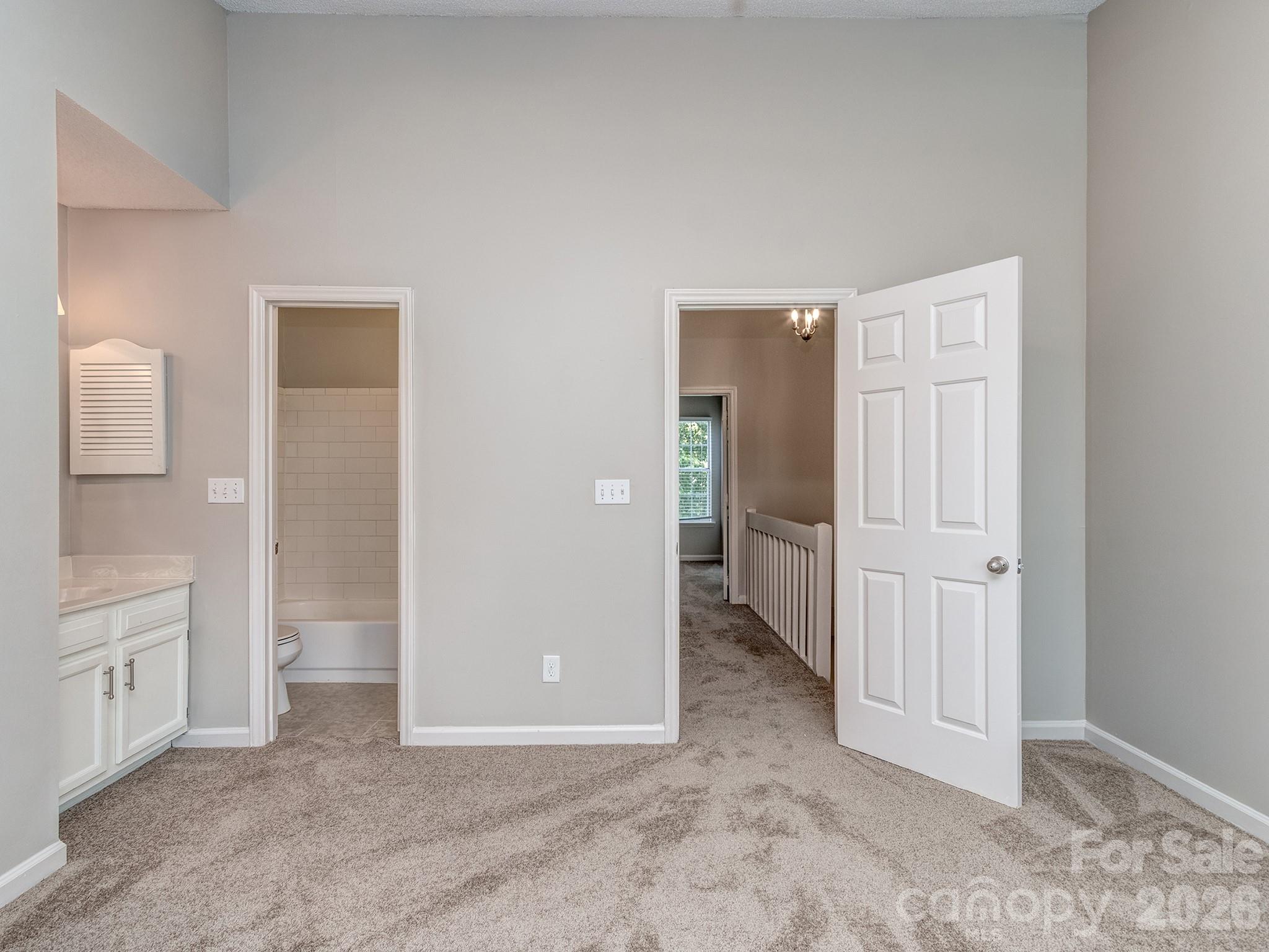 8211 Golf Ridge Drive Charlotte, NC 28277 - Photo 20 of 40 an empty room with a bathroom and a sink