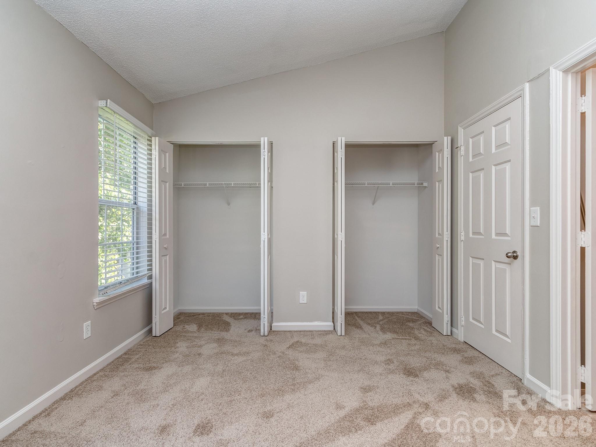 8211 Golf Ridge Drive Charlotte, NC 28277 - Photo 25 of 40 a view of an empty room with windows and closet