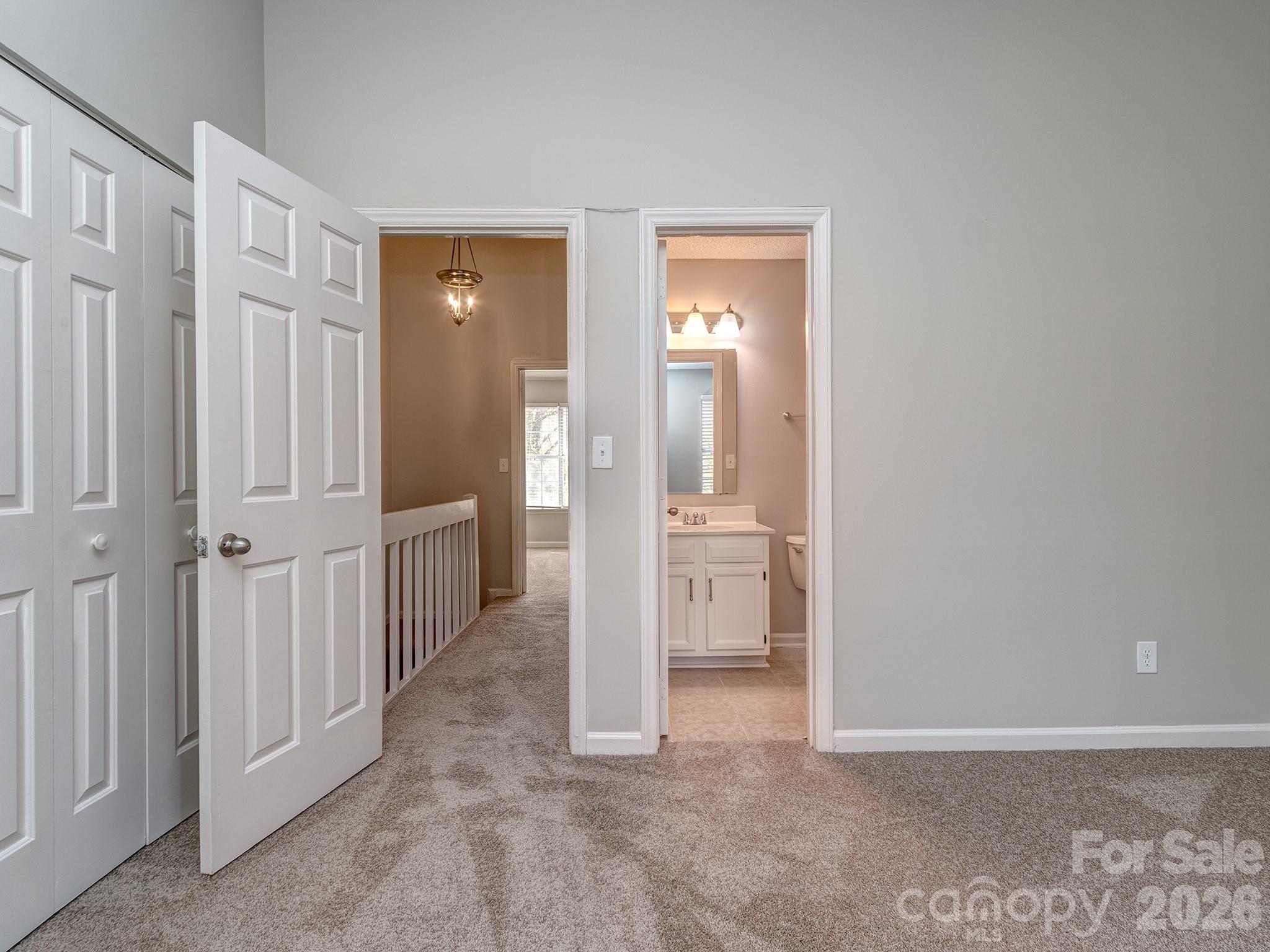 8211 Golf Ridge Drive Charlotte, NC 28277 - Photo 26 of 40 a view of a hallway with two rooms