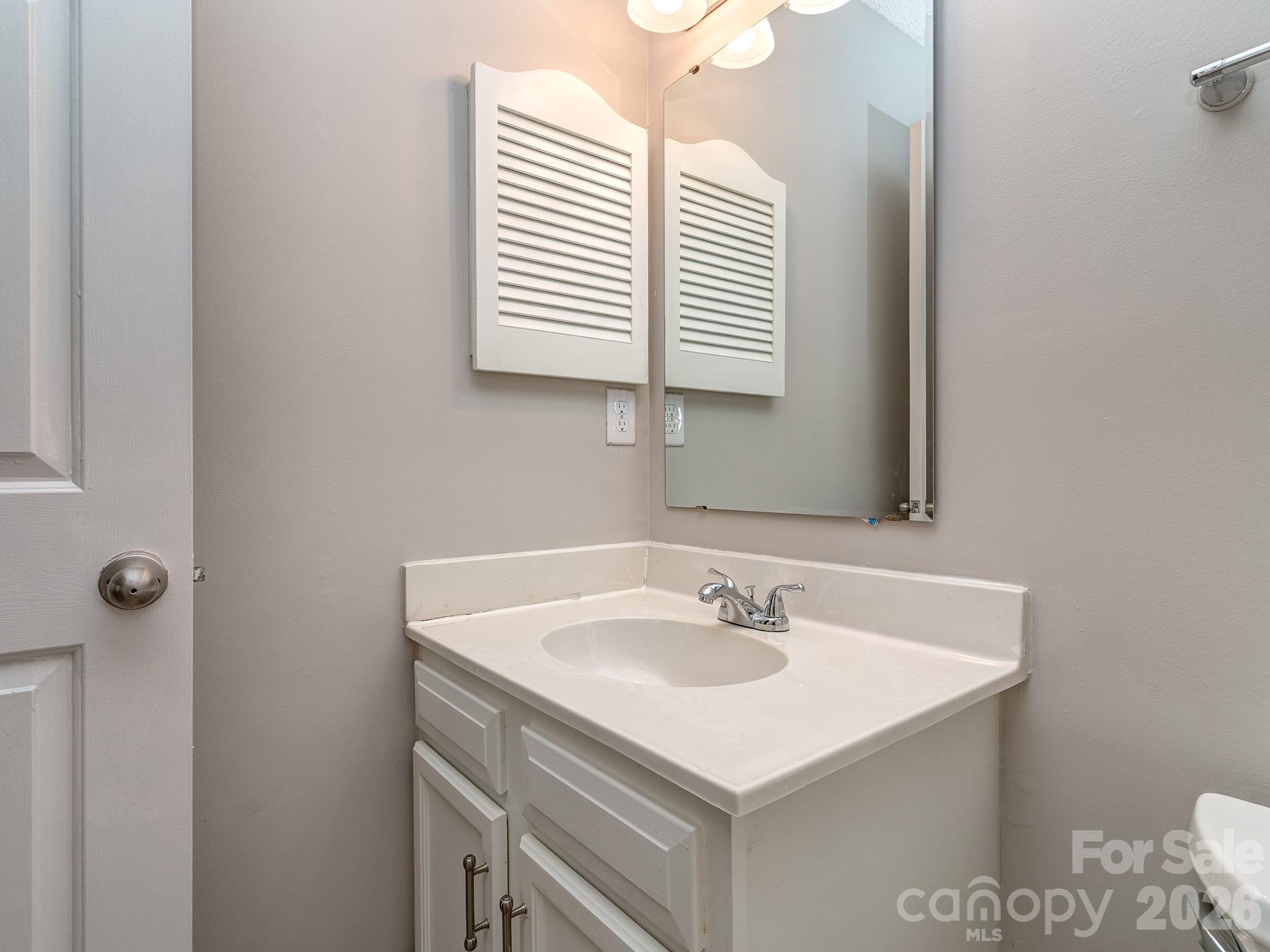 8211 Golf Ridge Drive Charlotte, NC 28277 - Photo 27 of 40 a bathroom with a sink and a vanity