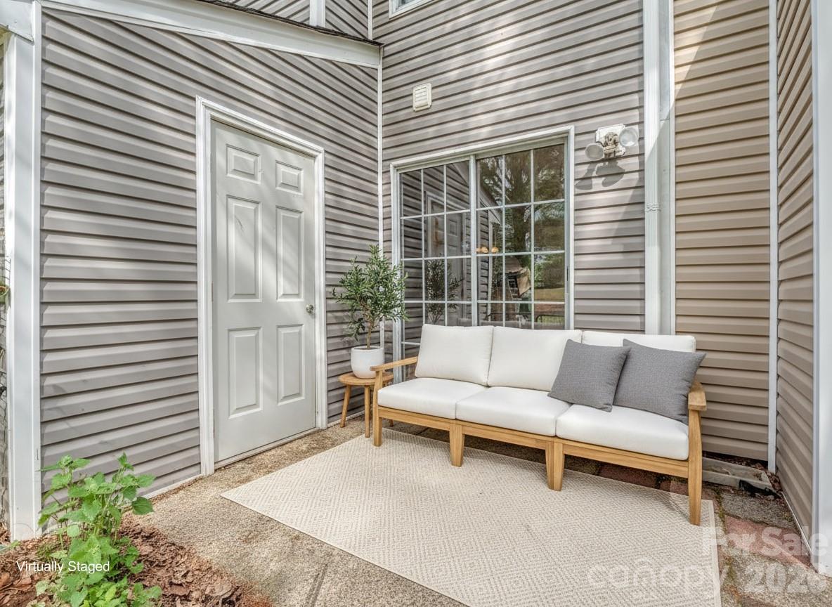 8211 Golf Ridge Drive Charlotte, NC 28277 - Photo 31 of 40 a view of a patio with couches and a potted plant