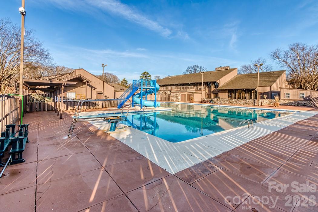 8211 Golf Ridge Drive Charlotte, NC 28277 - Photo 37 of 40 a view of a swimming pool with a patio