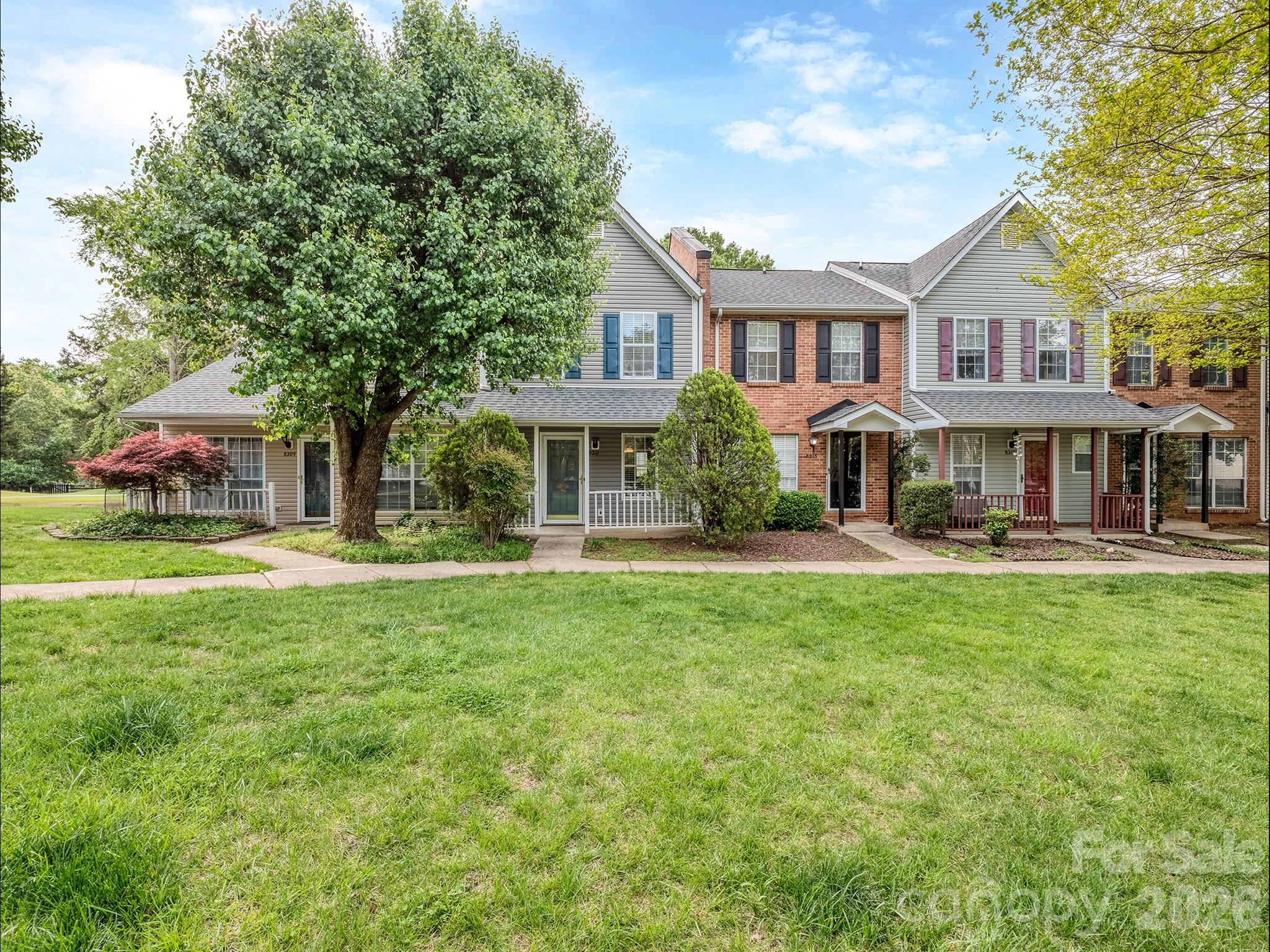 8211 Golf Ridge Drive Charlotte, NC 28277 - Photo 39 of 40 a front view of a house with yard and green space