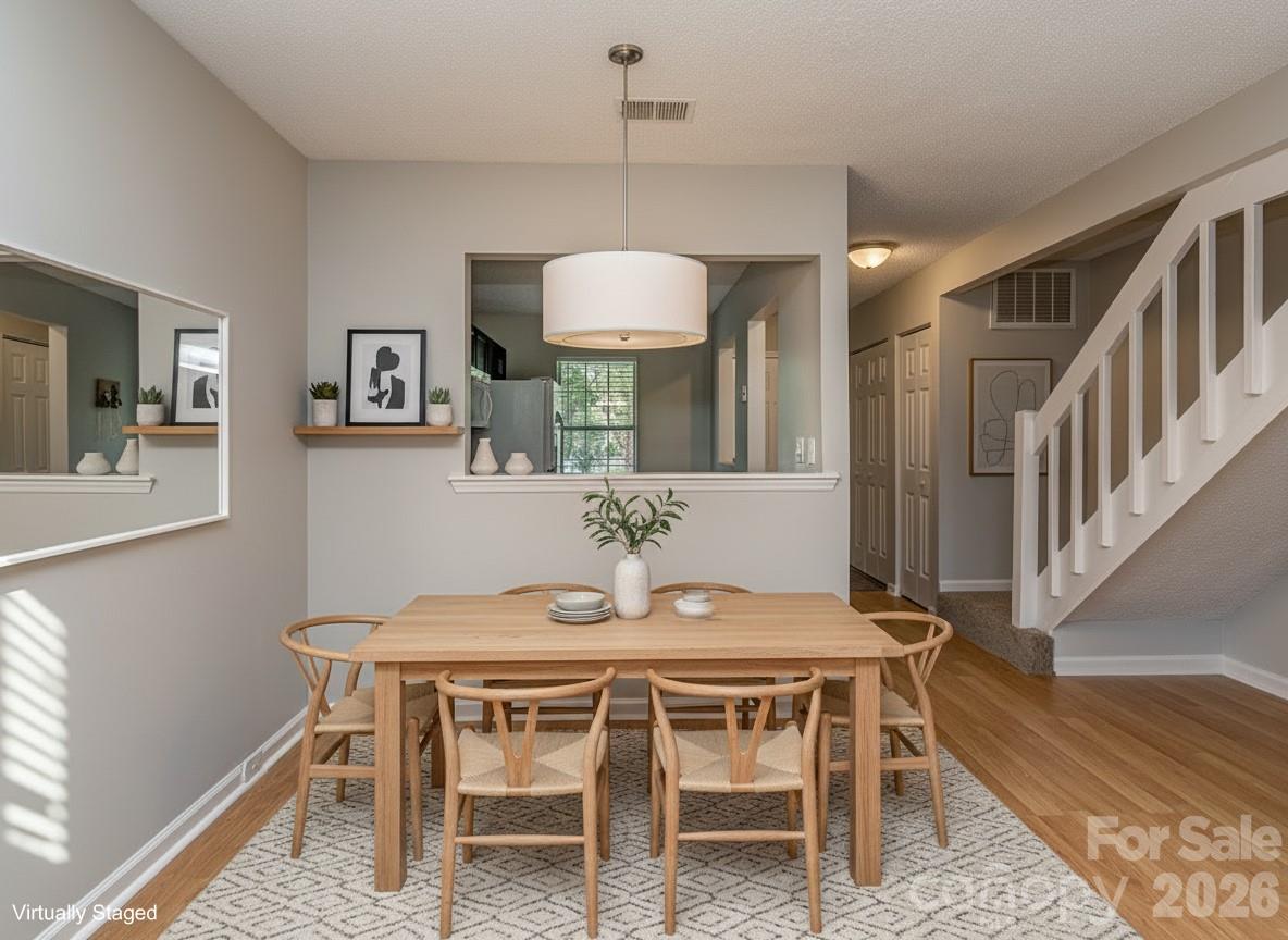 8211 Golf Ridge Drive Charlotte, NC 28277 - Photo 9 of 40 a dining room with furniture and window