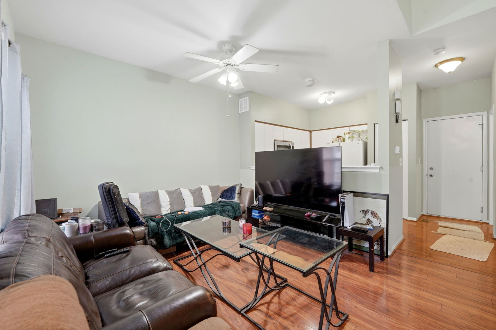 8 St Regis Court Elmhurst, IL 60126 - Photo 2 of 23 a living room with furniture and a flat screen tv