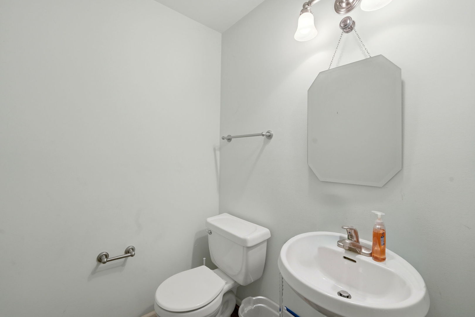 8 St Regis Court Elmhurst, IL 60126 - Photo 9 of 23 a bathroom with a toilet sink and mirror