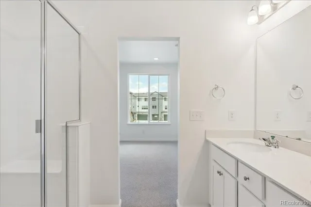 a bathroom with a sink toilet vanity and bathtub