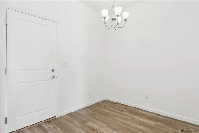 a bathroom with a toilet a sink and a mirror