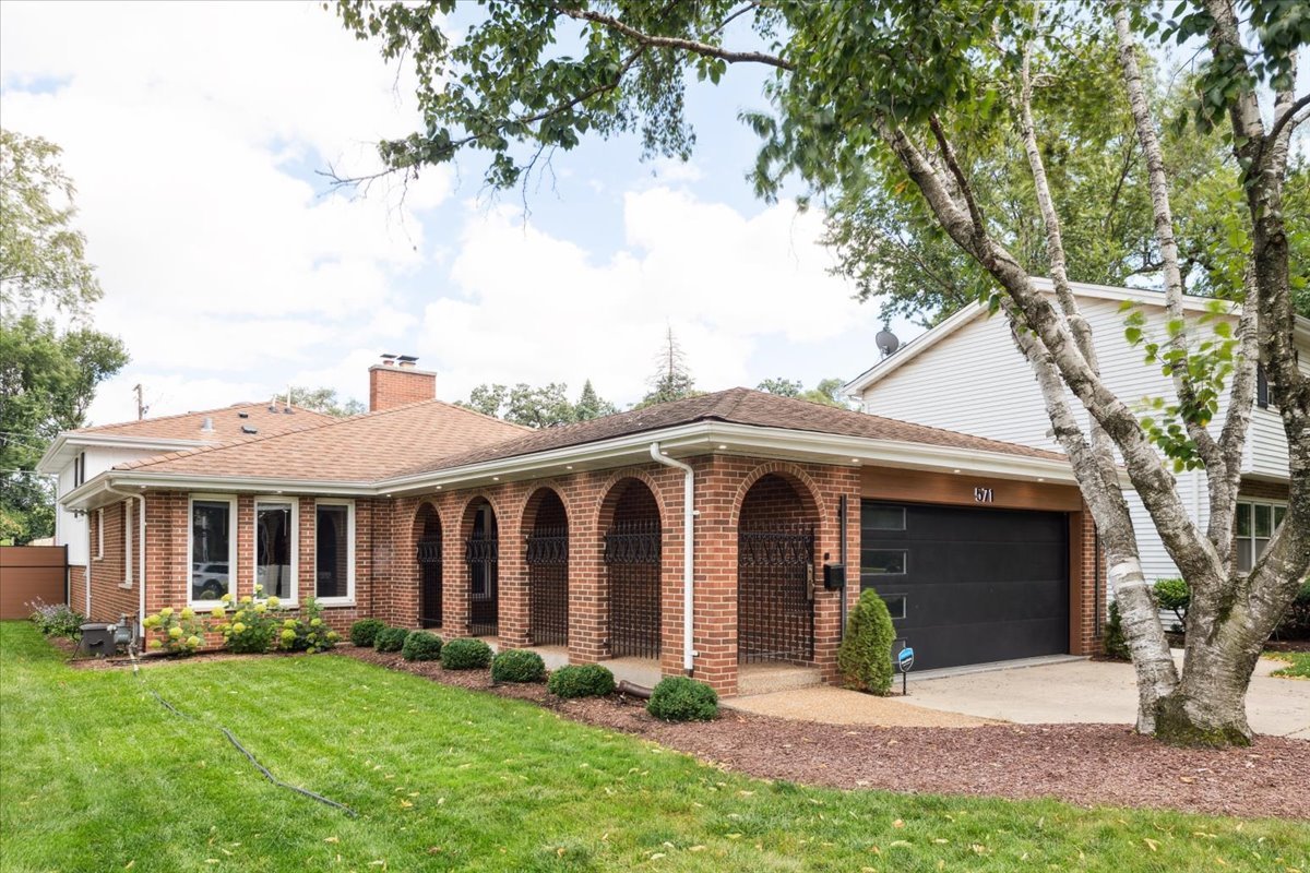 571 Byrd Road Riverside, IL 60546 - Photo 1 of 31 front view of a house with a yard
