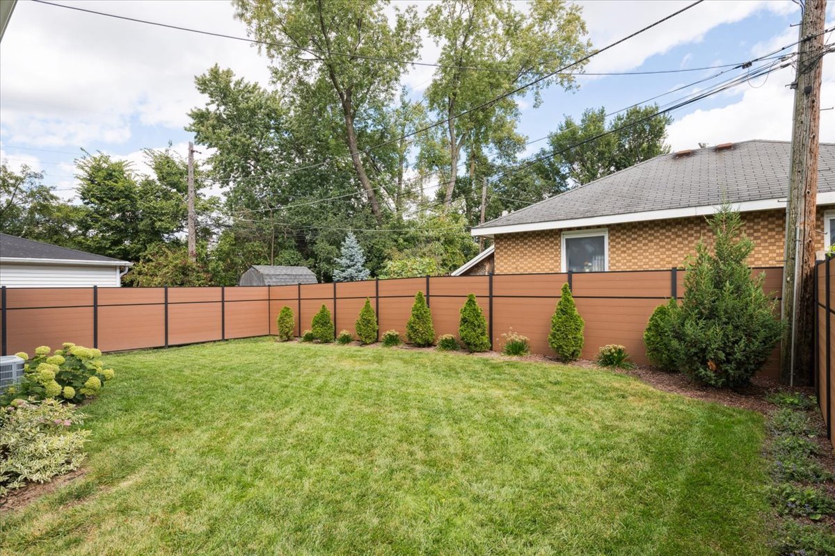 571 Byrd Road Riverside, IL 60546 - Photo 25 of 31 a view of a backyard with potted plants and large tree