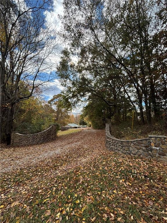 1628 Rockmart Road Villa Rica, GA 30180 - Photo 2 of 40 a view of a yard with large trees