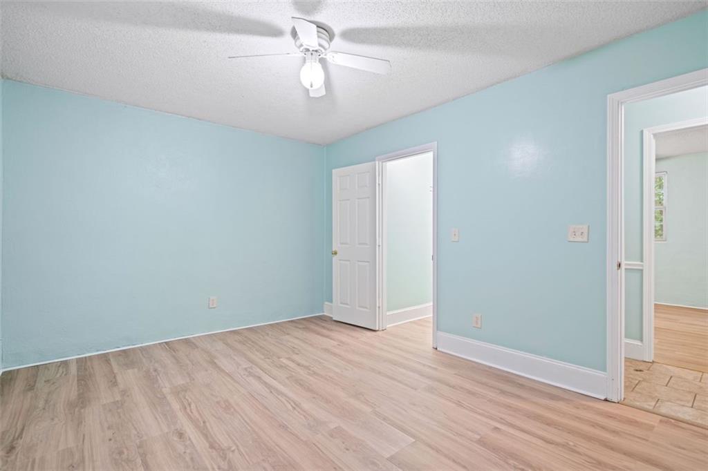 1628 Rockmart Road Villa Rica, GA 30180 - Photo 21 of 40 wooden floor in an empty room with a window