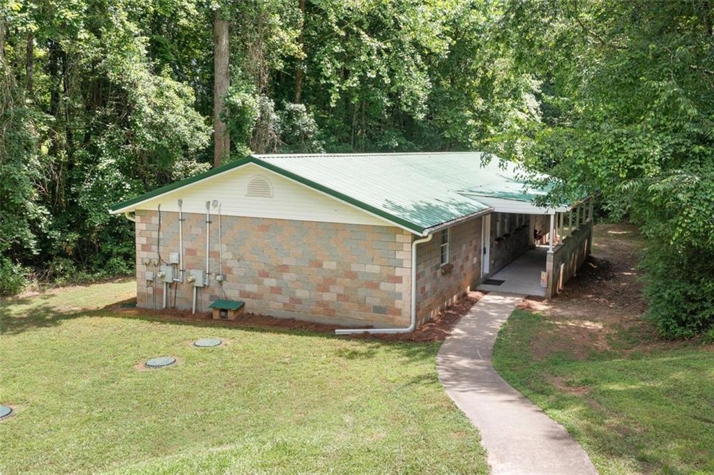 1628 Rockmart Road Villa Rica, GA 30180 - Photo 34 of 40 front view of a house with a yard