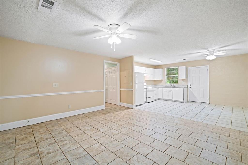 1628 Rockmart Road Villa Rica, GA 30180 - Photo 8 of 40 a view of an empty room with a window