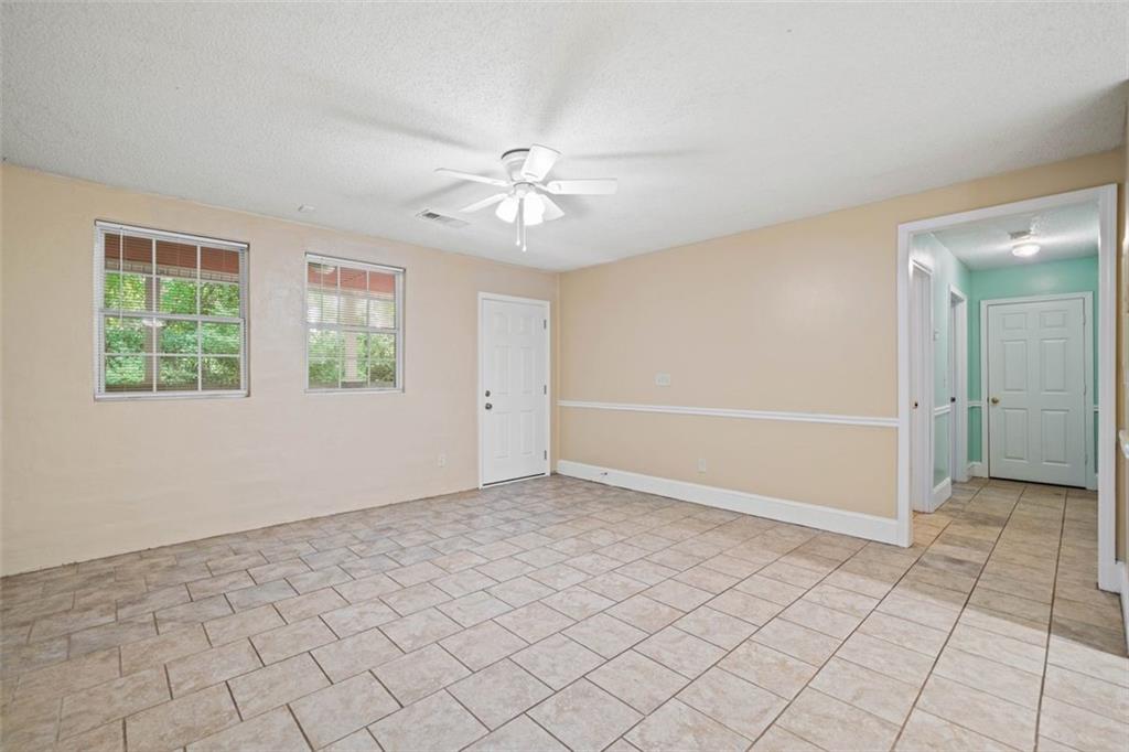 1628 Rockmart Road Villa Rica, GA 30180 - Photo 9 of 40 wooden floor in an empty room with a window