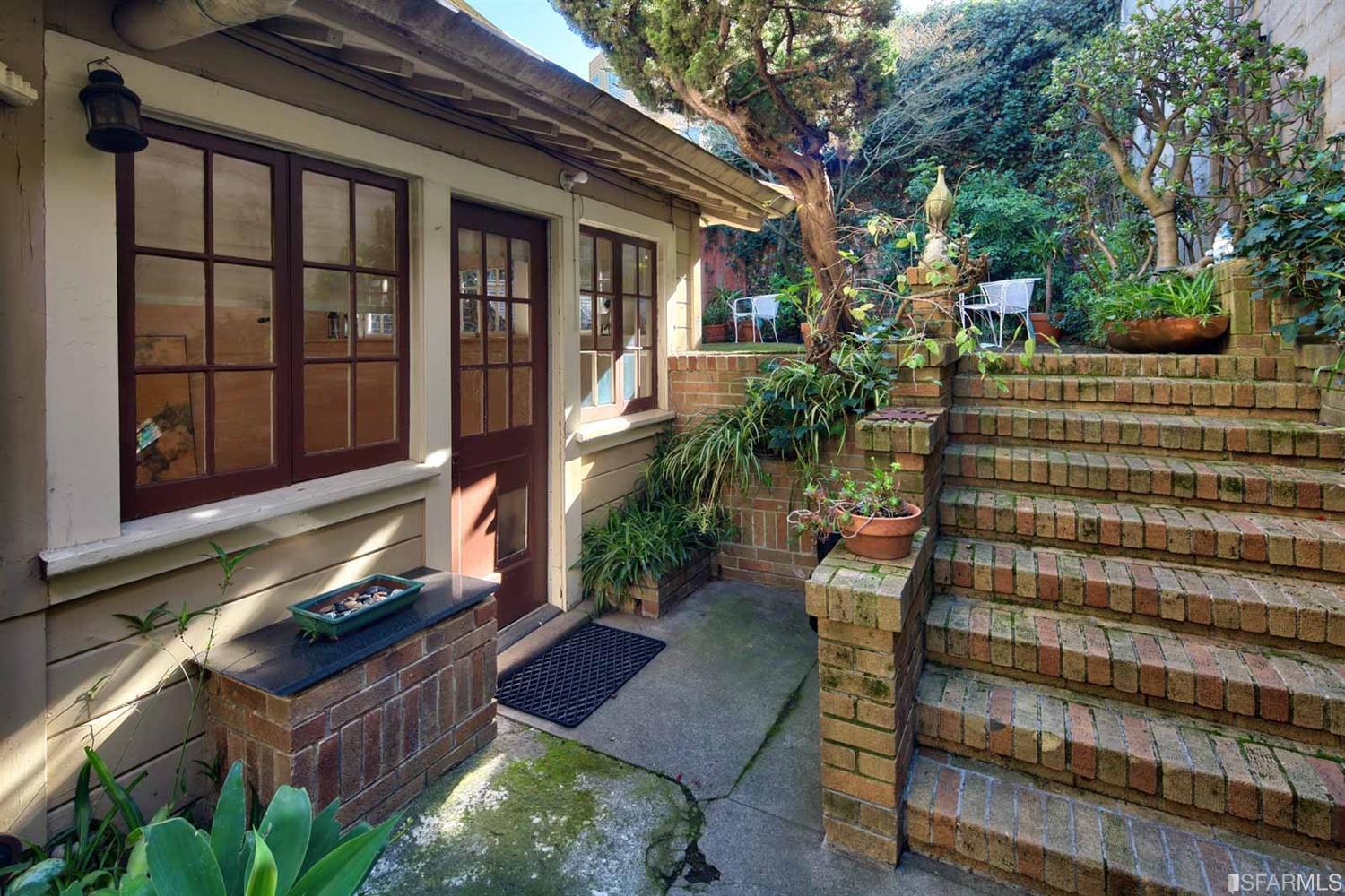 1659 Jackson Street San Francisco, CA 94109 - Photo 1 of 27 a backyard of a house with outdoor seating