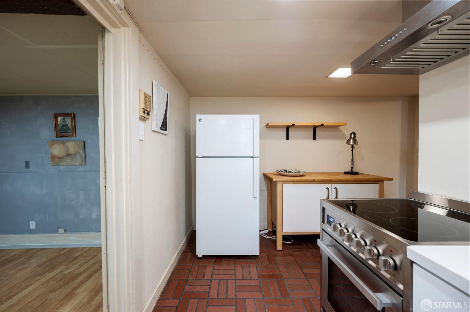 1659 Jackson Street San Francisco, CA 94109 - Photo 13 of 27 a kitchen with stainless steel appliances granite countertop a refrigerator and a sink