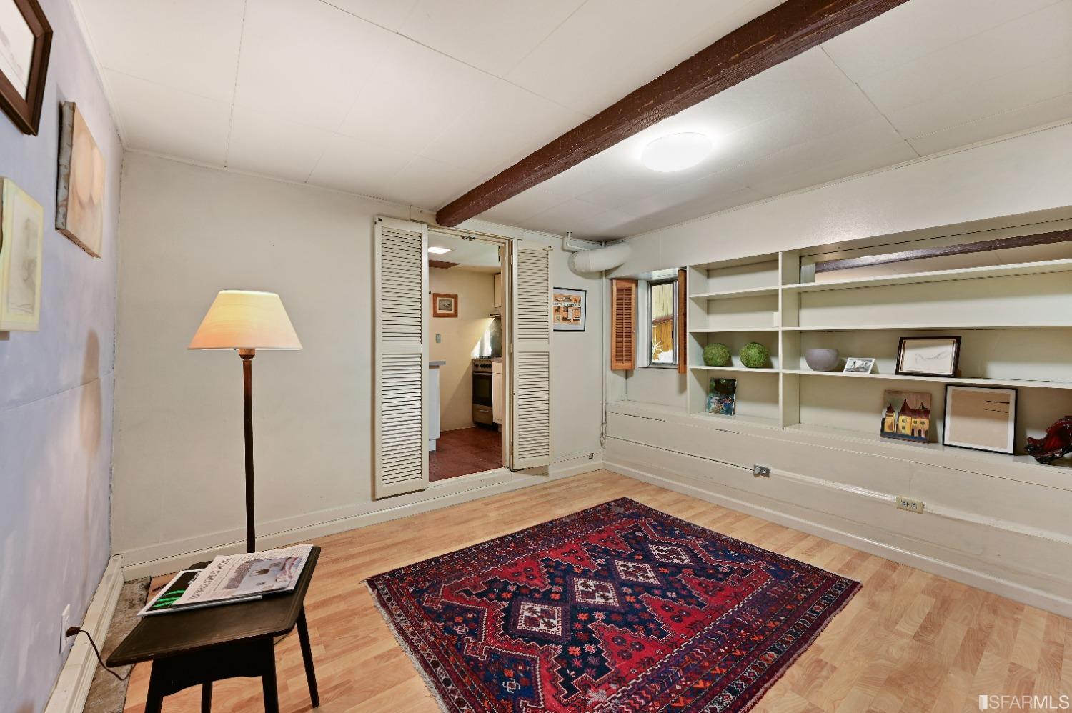 1659 Jackson Street San Francisco, CA 94109 - Photo 14 of 27 a living room with a couch and a rug