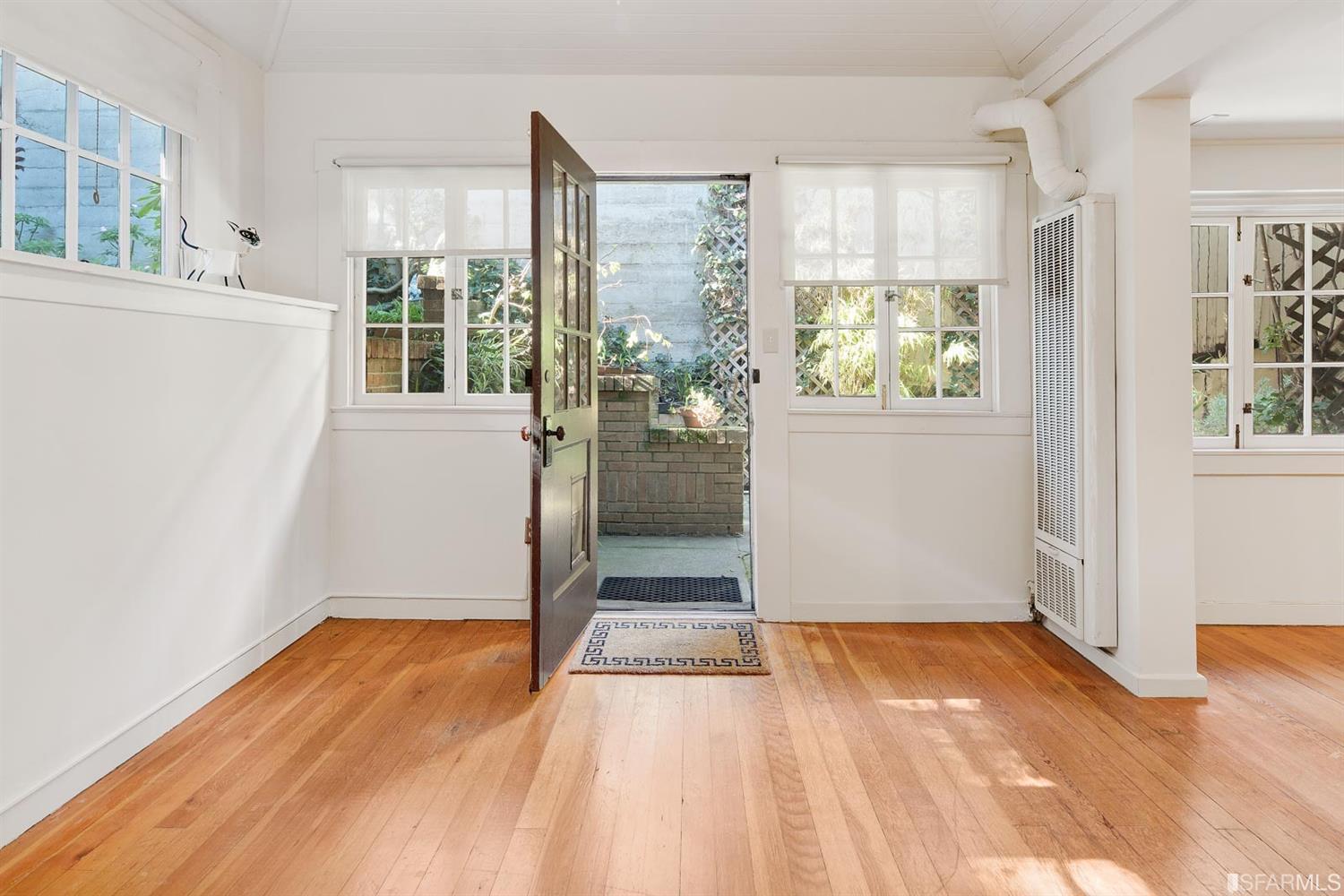 1659 Jackson Street San Francisco, CA 94109 - Photo 3 of 27 a view of empty room with wooden floor and fan