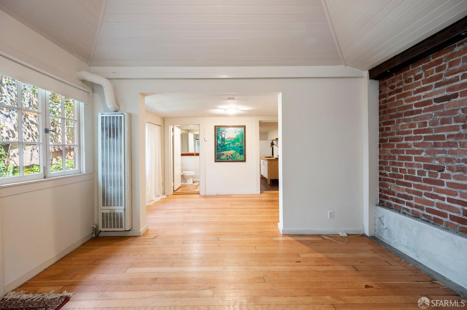 1659 Jackson Street San Francisco, CA 94109 - Photo 8 of 27 a view of a room with wooden floor and windows