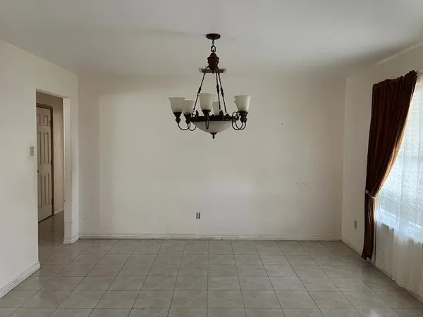 a view of a hallway with a chandelier