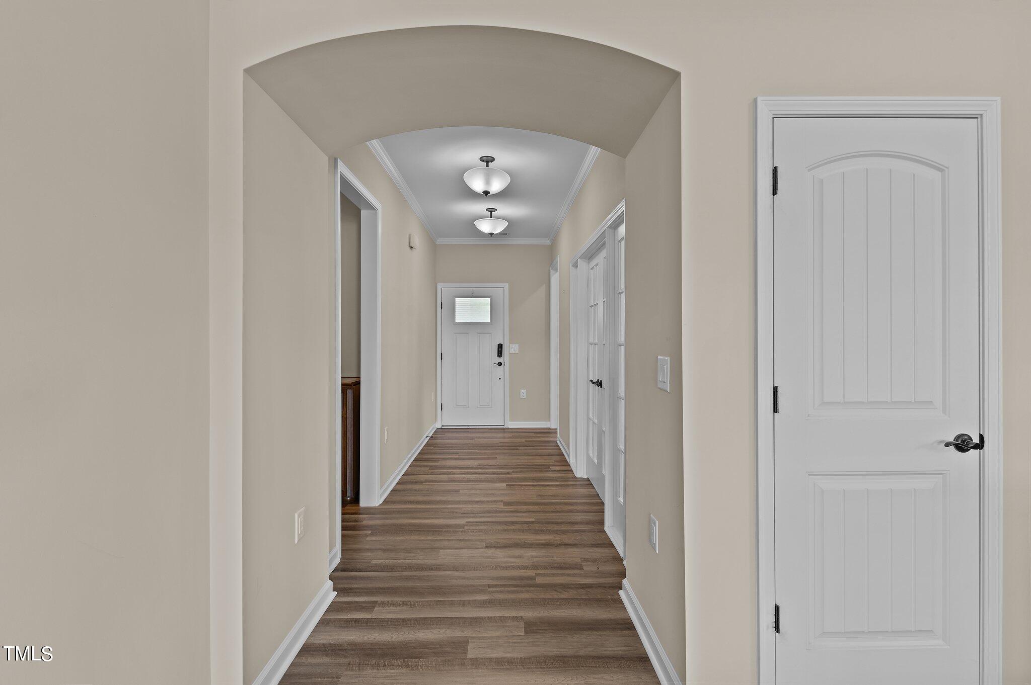 1013 Calista Drive Wake Forest, NC 27587 - Photo 11 of 40 a view of a hallway with wooden floor