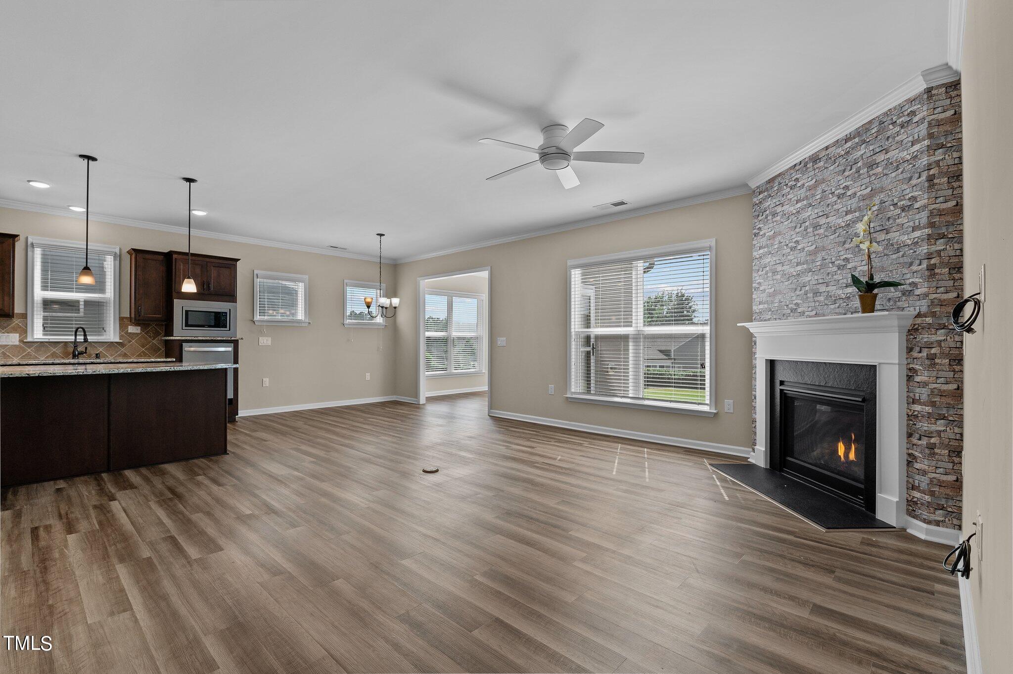 1013 Calista Drive Wake Forest, NC 27587 - Photo 14 of 40 a view of kitchen with cabinets and wooden floor