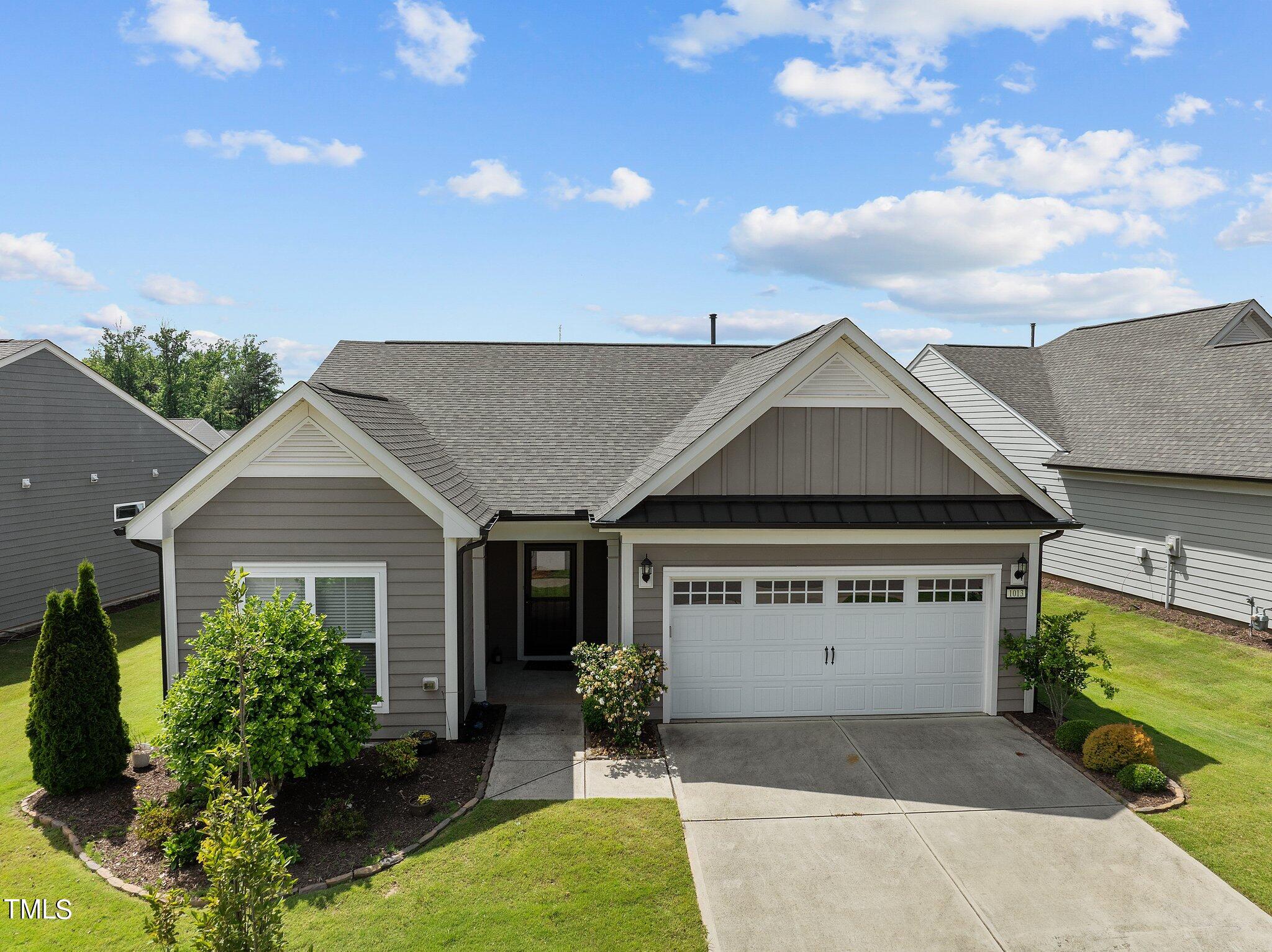 1013 Calista Drive Wake Forest, NC 27587 - Photo 2 of 40 front view of a house with a yard