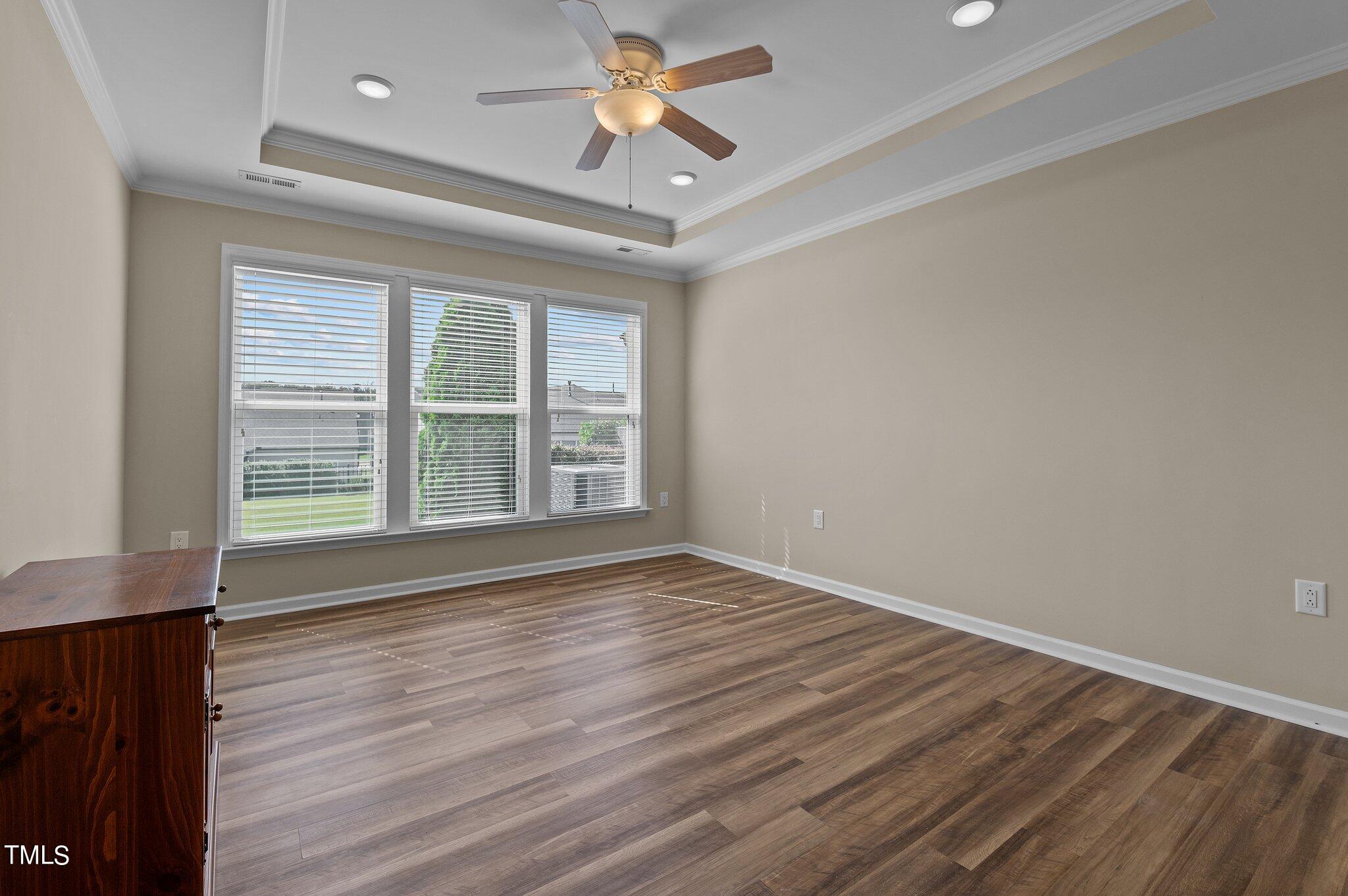 1013 Calista Drive Wake Forest, NC 27587 - Photo 22 of 40 a view of room with window and wooden floor