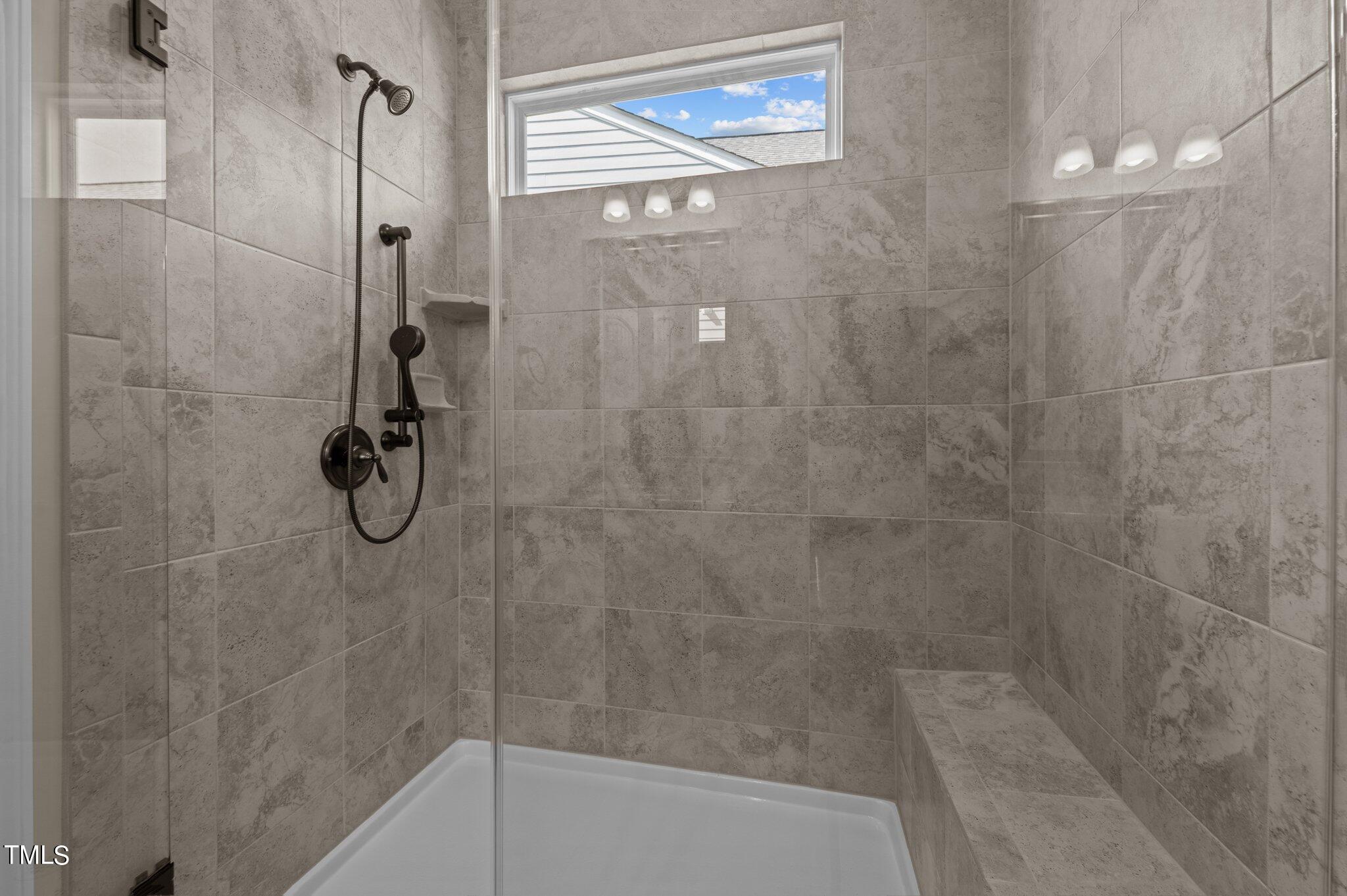 1013 Calista Drive Wake Forest, NC 27587 - Photo 26 of 40 a bathroom with a shower