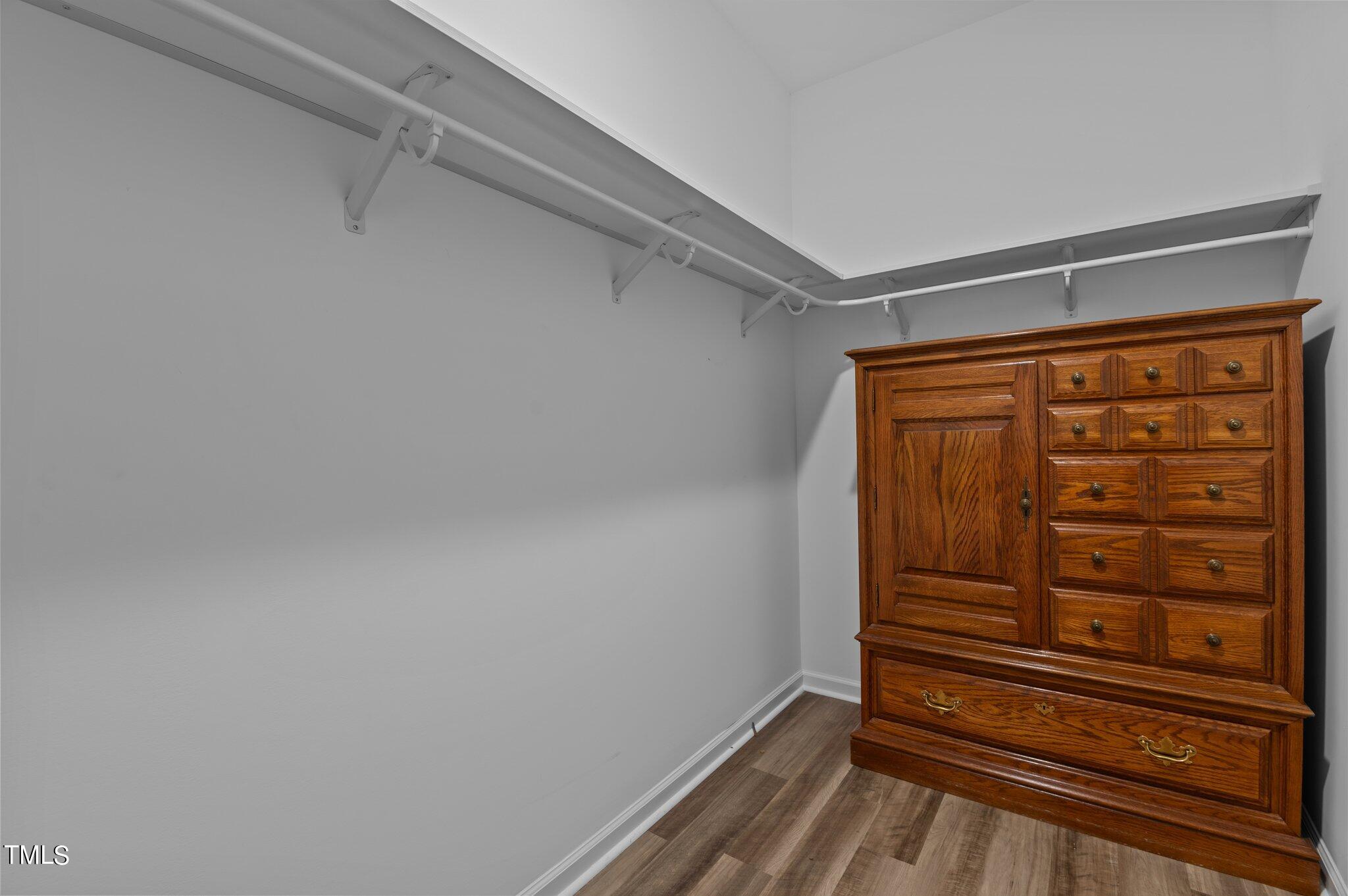 1013 Calista Drive Wake Forest, NC 27587 - Photo 27 of 40 a view of walk in closet with empty racks