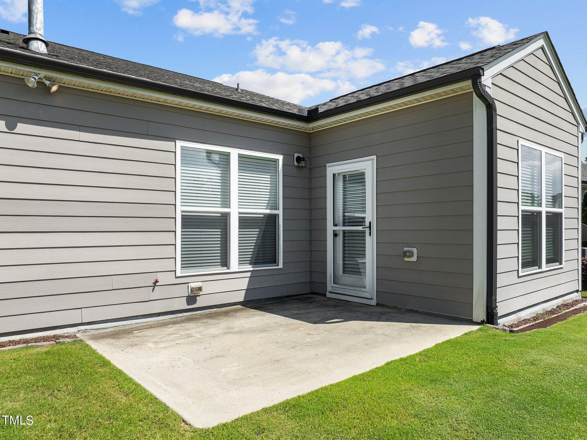 1013 Calista Drive Wake Forest, NC 27587 - Photo 28 of 40 a front view of a house with a yard