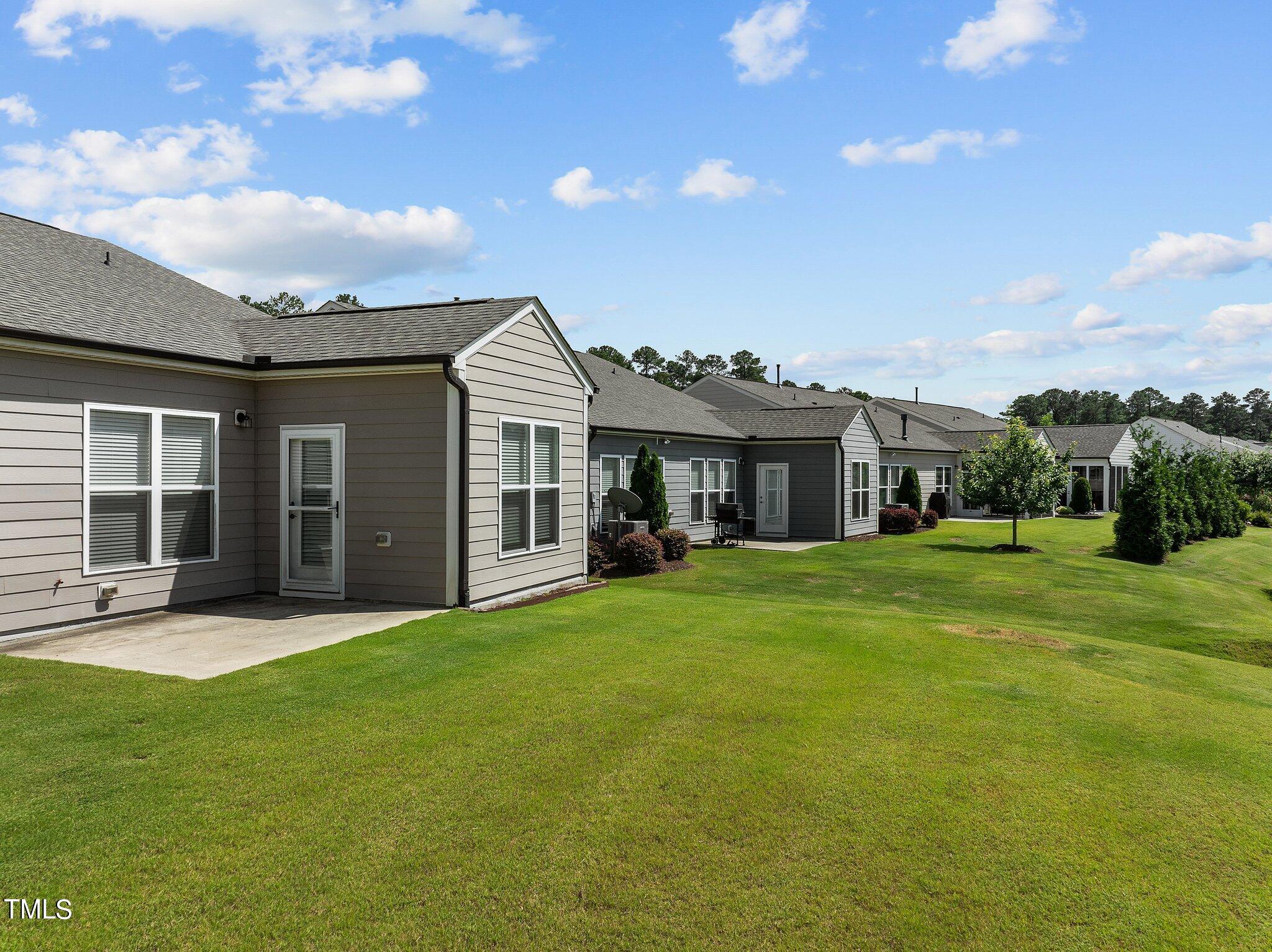 1013 Calista Drive Wake Forest, NC 27587 - Photo 30 of 40 a front view of a house with a garden