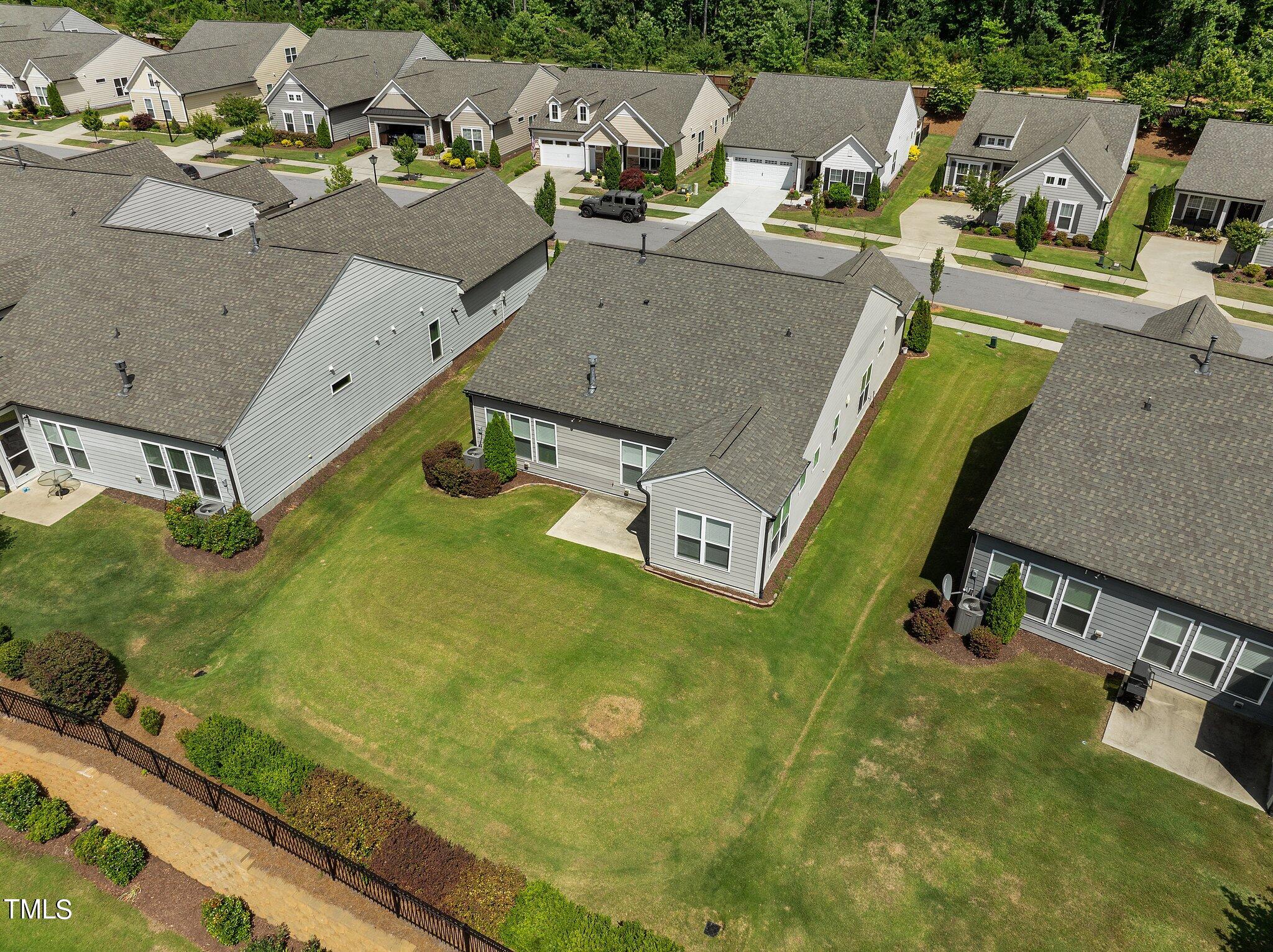 1013 Calista Drive Wake Forest, NC 27587 - Photo 37 of 40 an aerial view of a house with garden space and street view