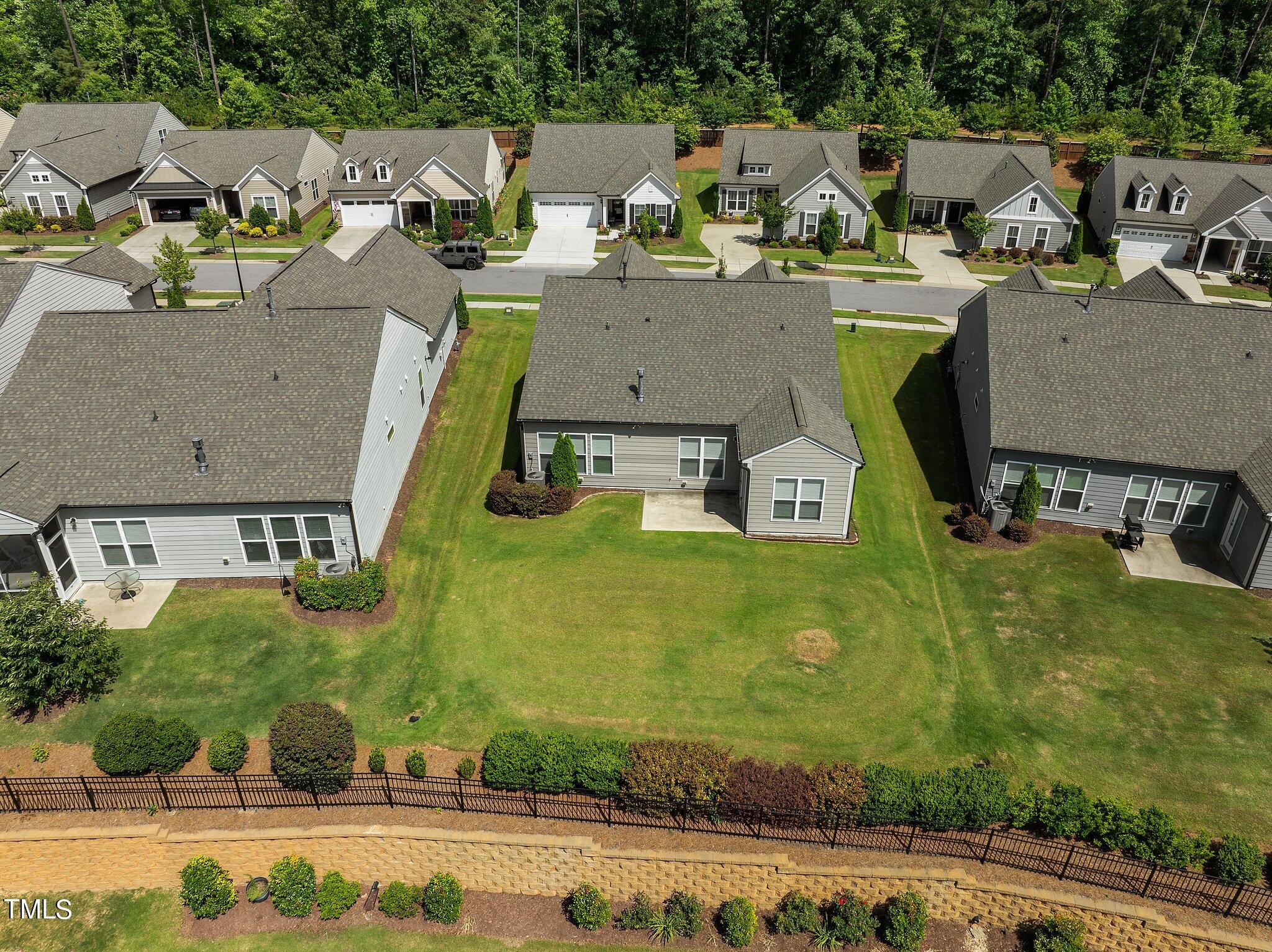 1013 Calista Drive Wake Forest, NC 27587 - Photo 38 of 40 an aerial view of residential houses with outdoor space and trees
