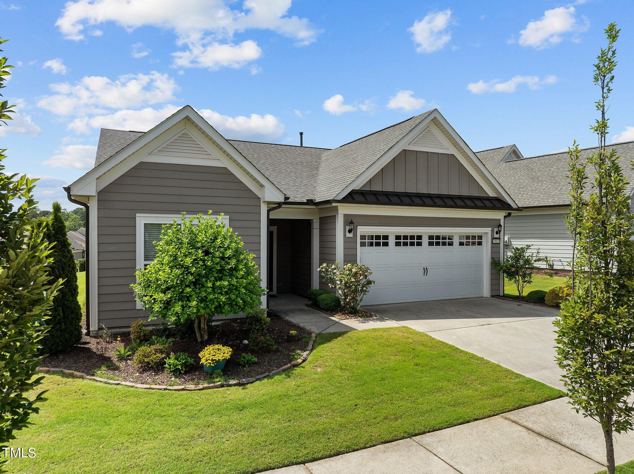 1013 Calista Drive Wake Forest, NC 27587 - Photo 4 of 40 a front view of a house with a yard