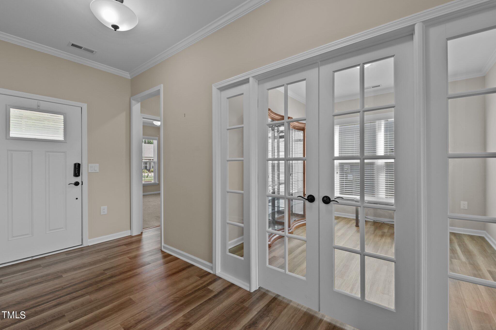 1013 Calista Drive Wake Forest, NC 27587 - Photo 5 of 40 a view of wooden floor and windows in a room