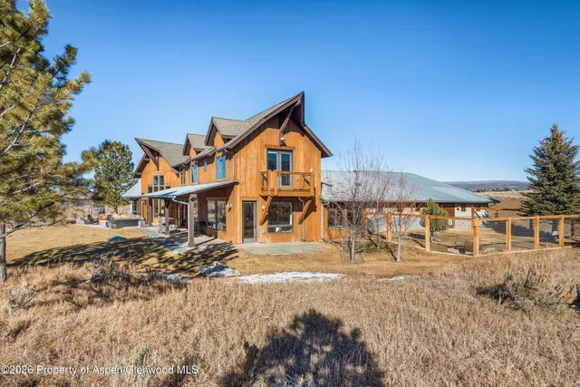 a view of a house with a snow in a yard