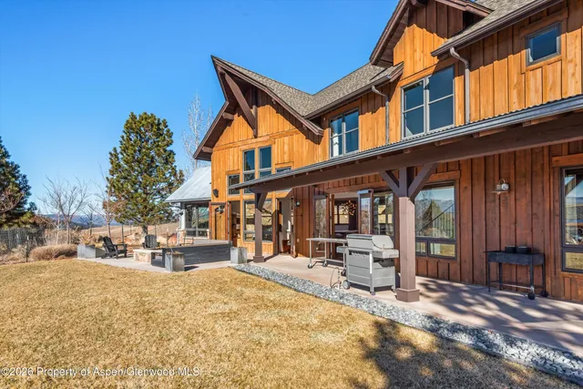 a front view of a building with sitting area