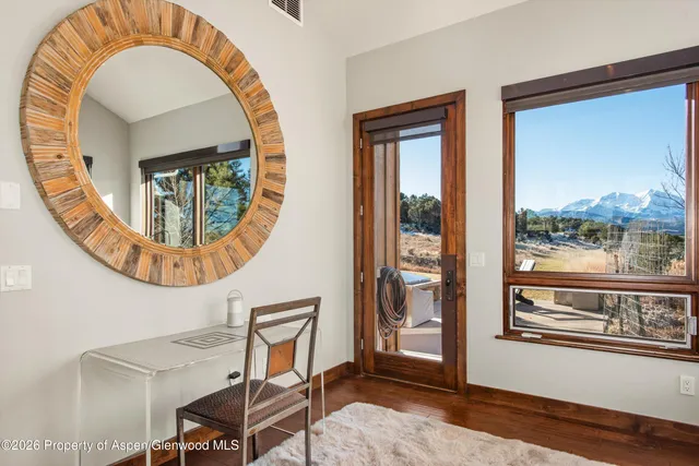 a view of a dining room with furniture window and wooden floor