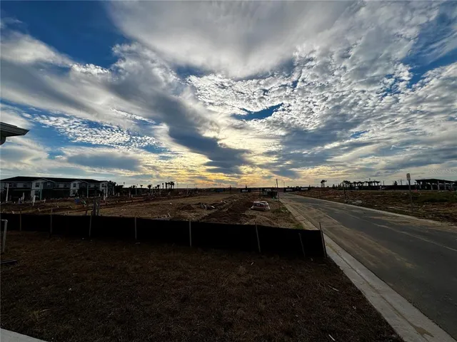 a view of kitchen with refrigerator and window