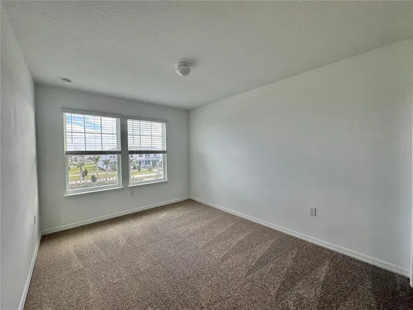 a bathroom with a sink toilet vanity and shower